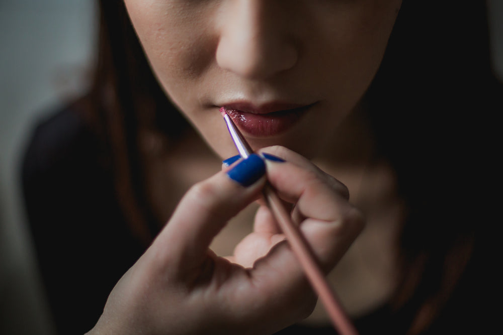 woman getting lip makeup