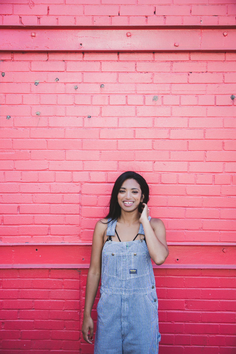 woman happy pink wall portrait