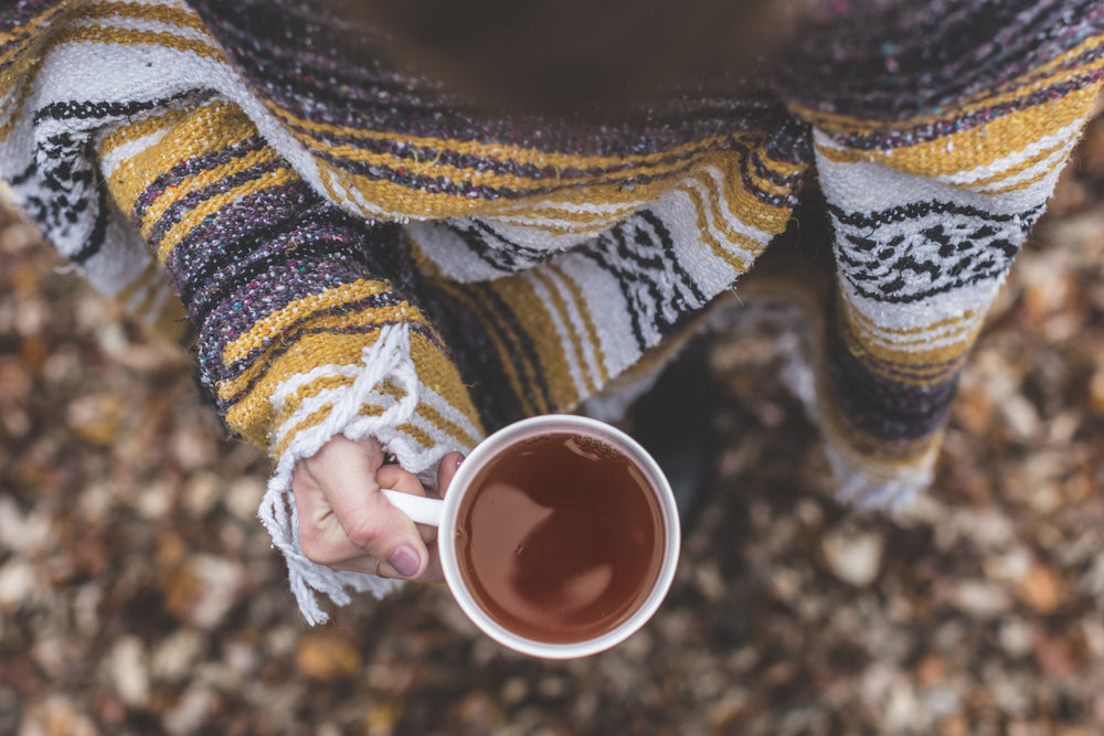 woman holding black tea