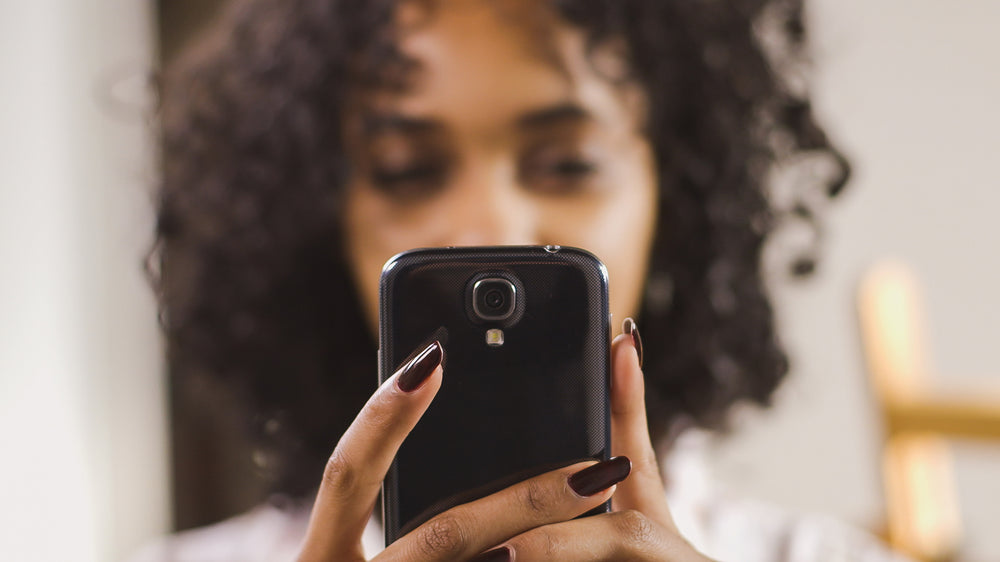 woman holding mobile phone