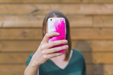 woman holding up iphone