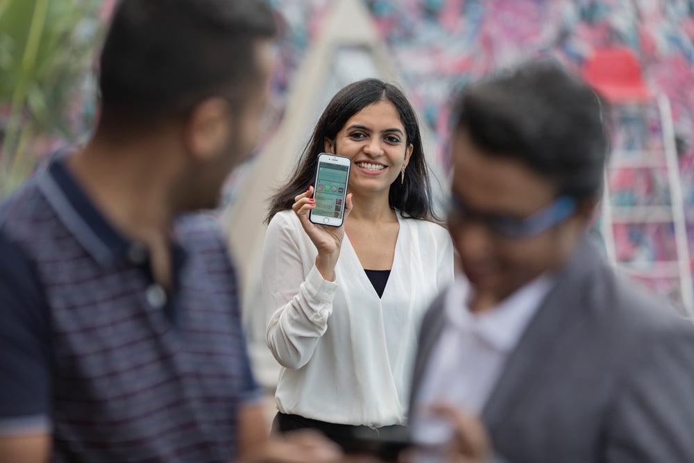 woman holding up mobile smart phone