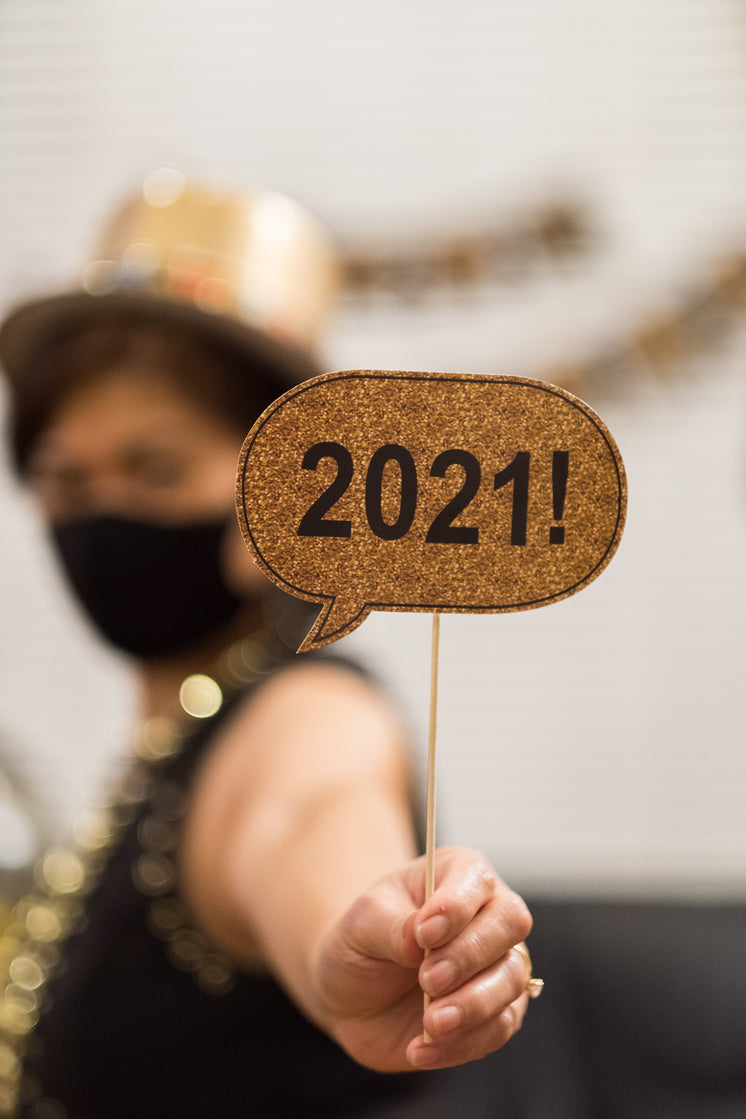 woman-holds-up-small-happy-2021-sign.jpg