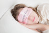woman in beauty rest mask in pillow