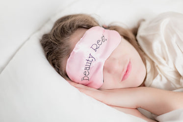 woman in beauty rest mask in pillow