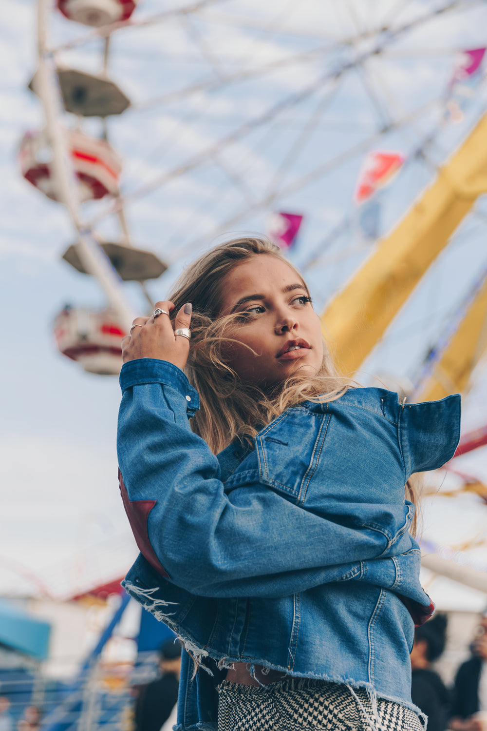 woman in denim jacket at fair