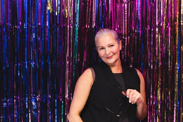 woman in front of multicolored background