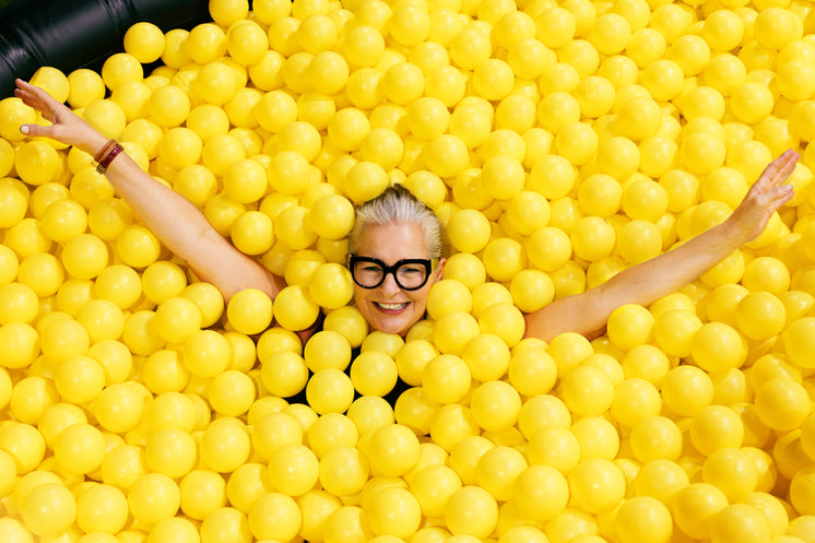 woman-in-glasses-in-yellow-ball-pool.jpg