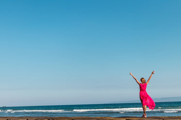 woman in red by the sea