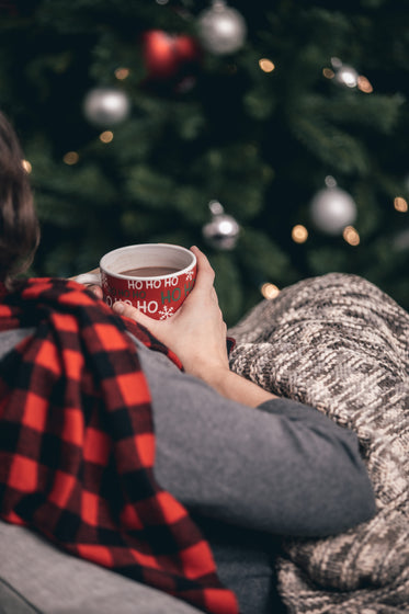 woman in scarf drinking hot chocolate