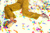 woman in silver leather oxfords laying in confetti