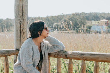 woman in sunglasses takes in a country view