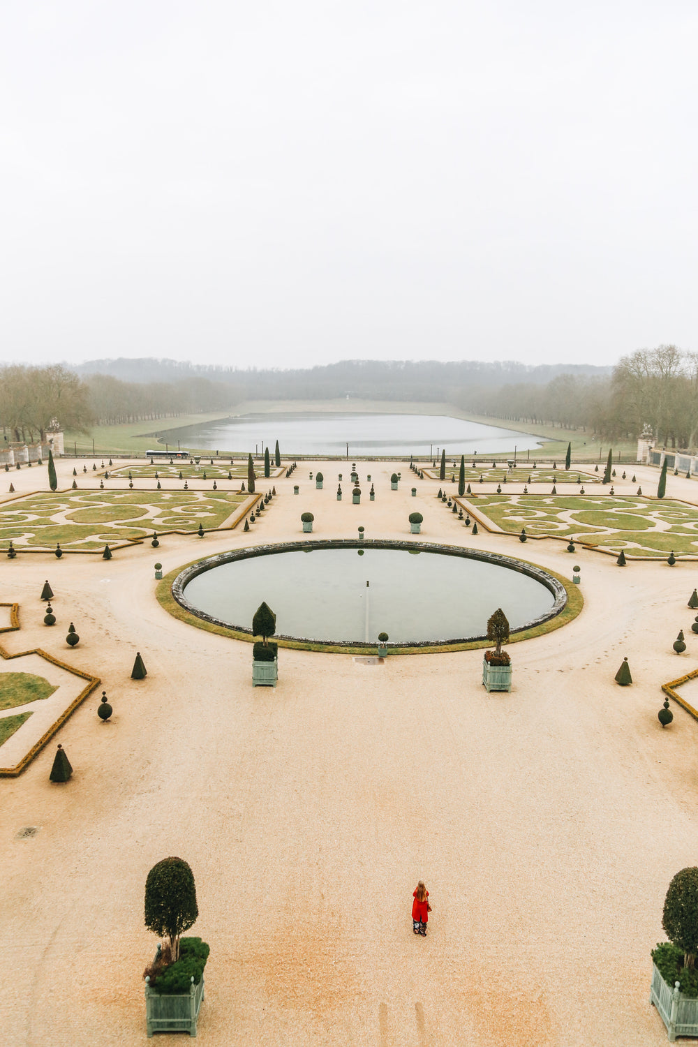 woman in the gardens of versailles