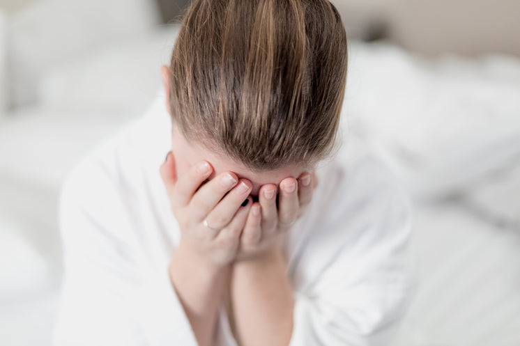 Woman In White Robe Hides Face