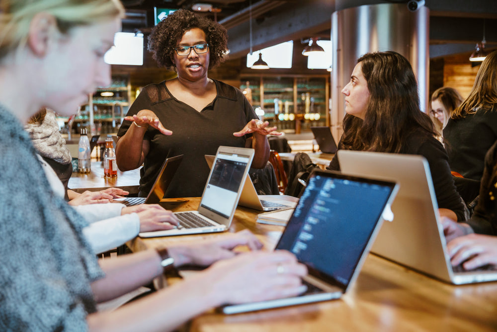 woman instructing on laptop