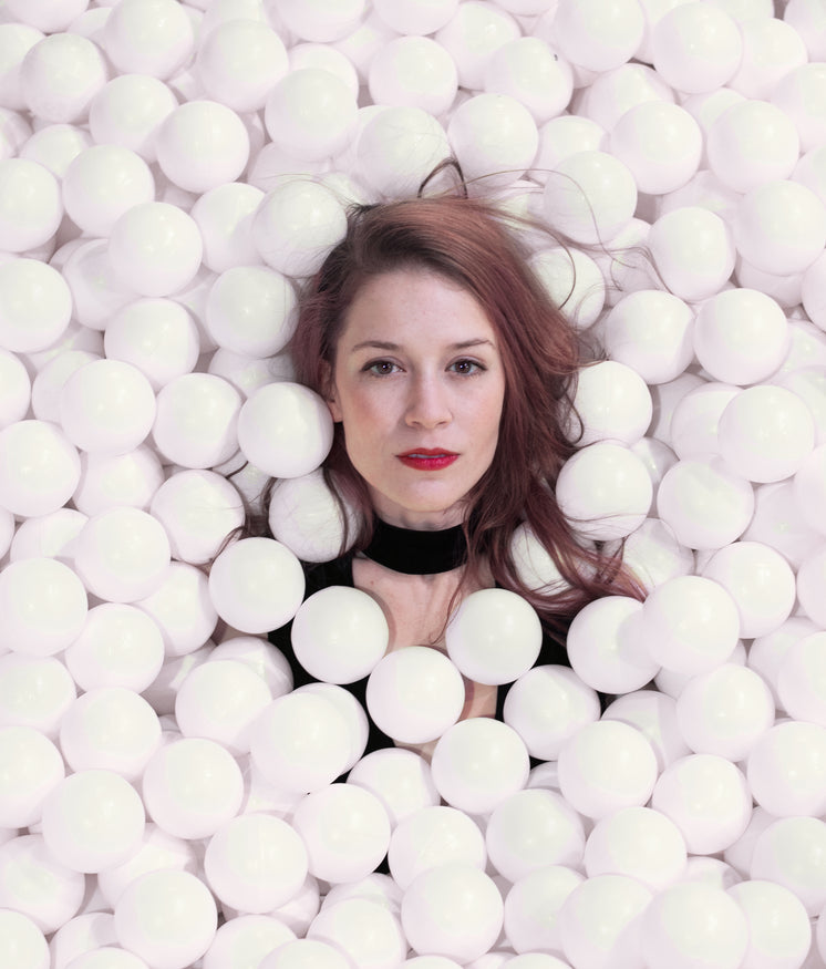 Woman Is Completely Covered In White Styrofoam Balls