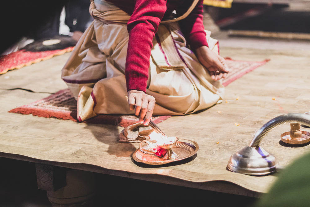 woman lighting incense