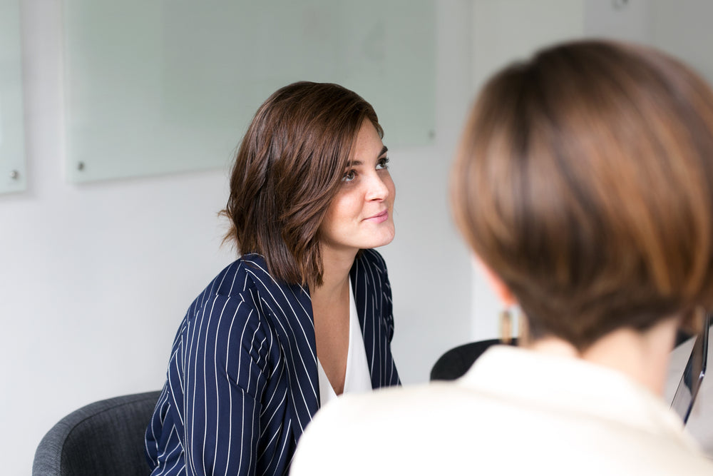 woman listening at team meeting