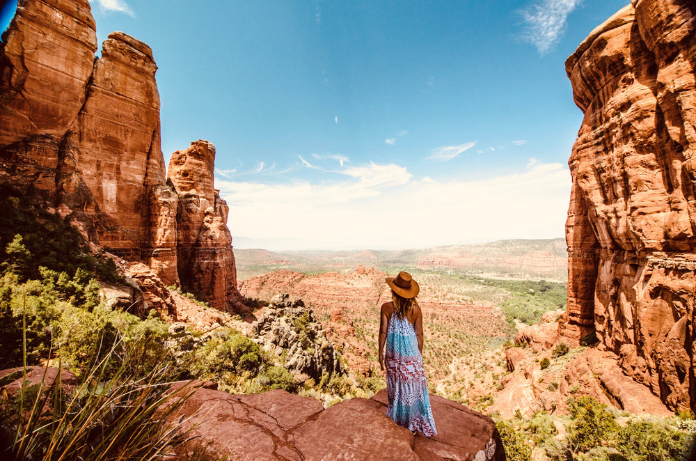 woman looks out over desert valley