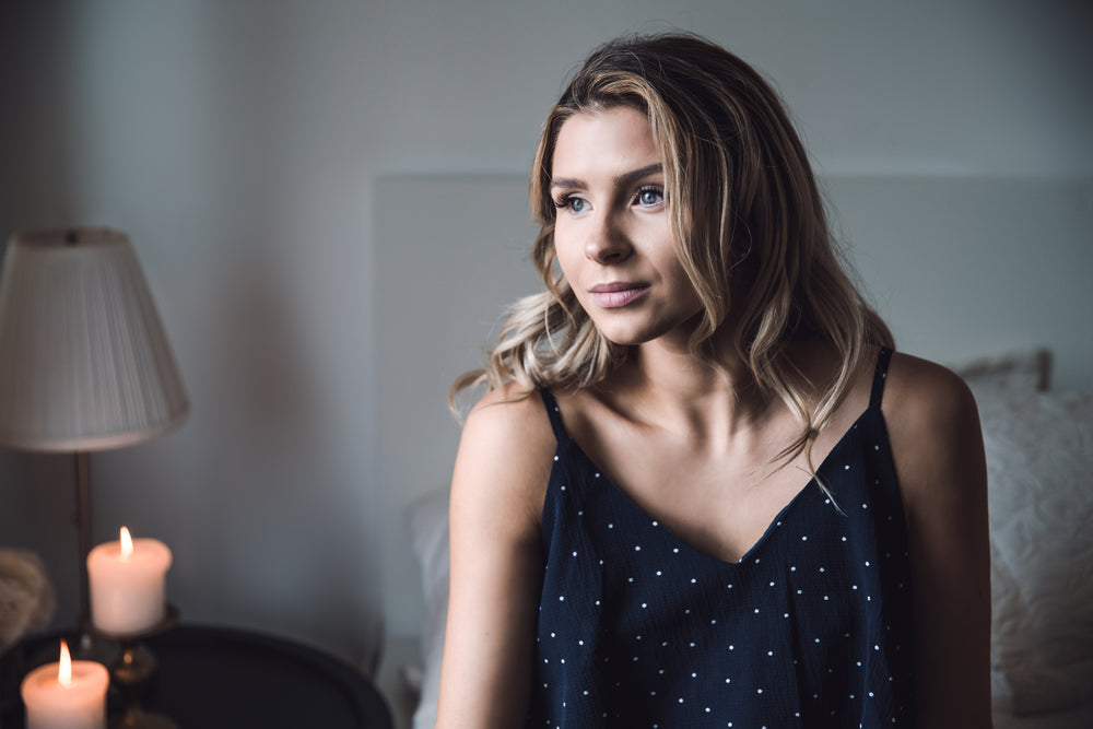 woman on bed looking away