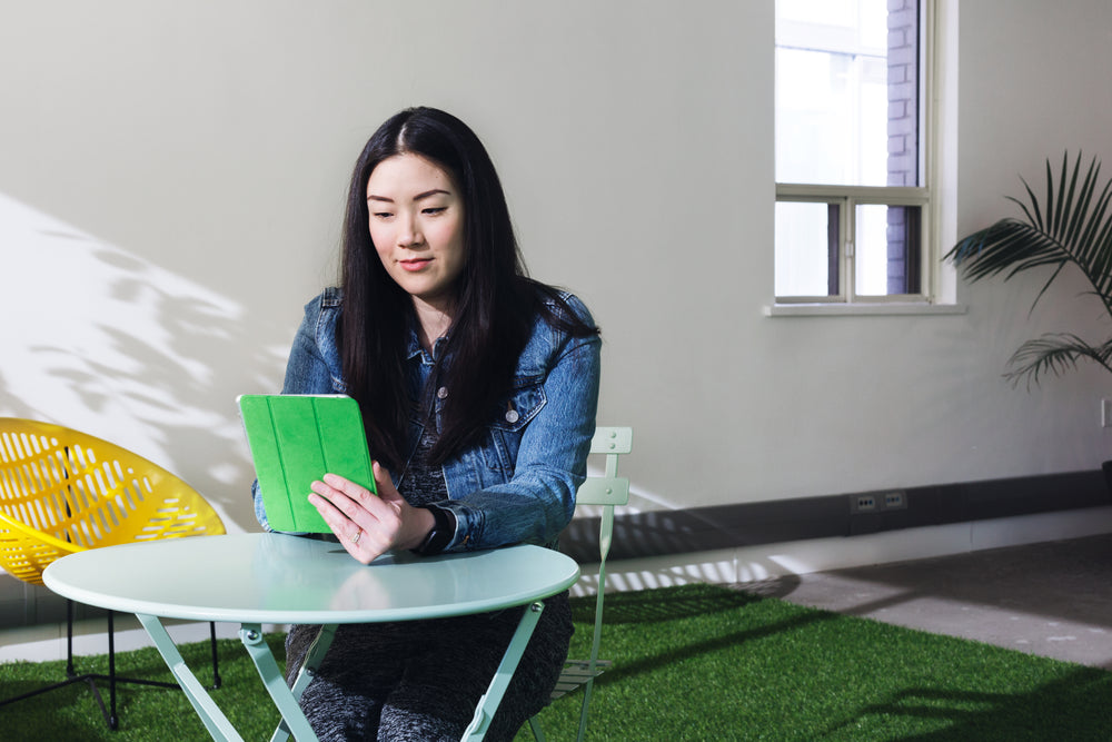 woman on tablet patio