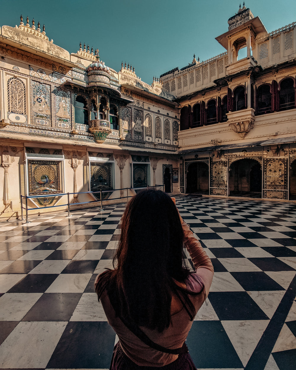 woman photographs beautiful architecture