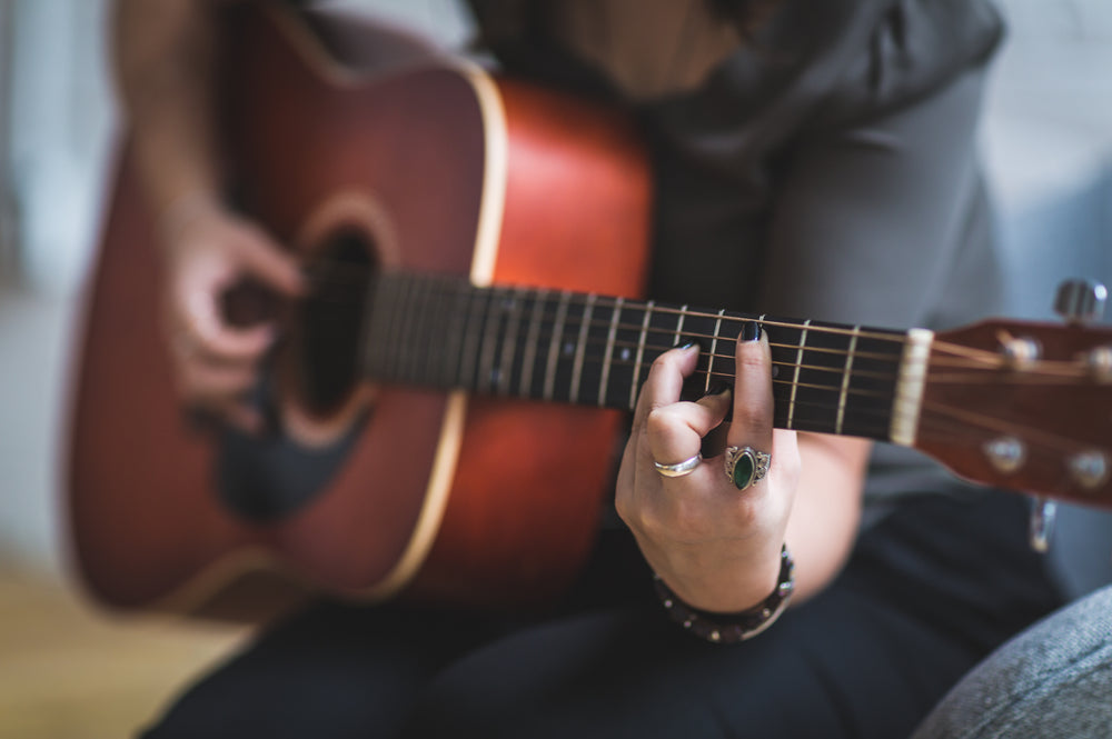 woman playing guitar