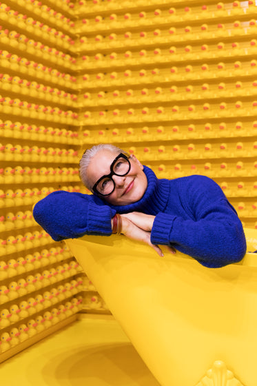 woman playing in yellow tub