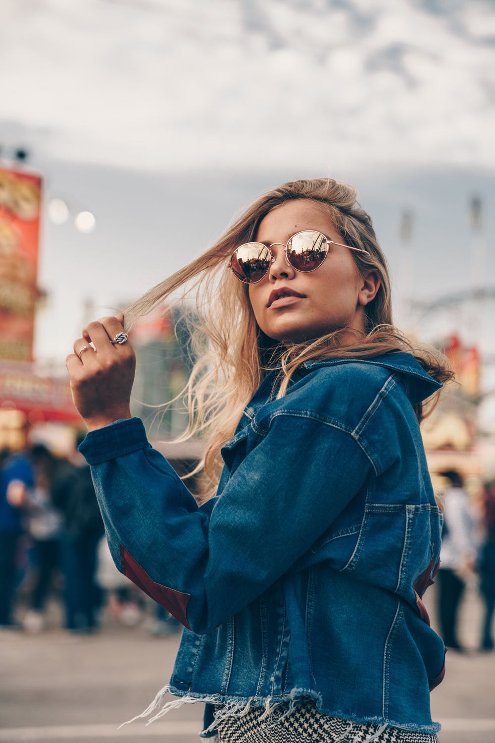 woman playing with blonde hair