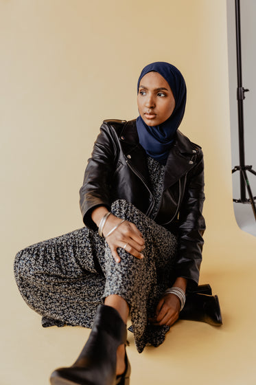 woman poses in a studio