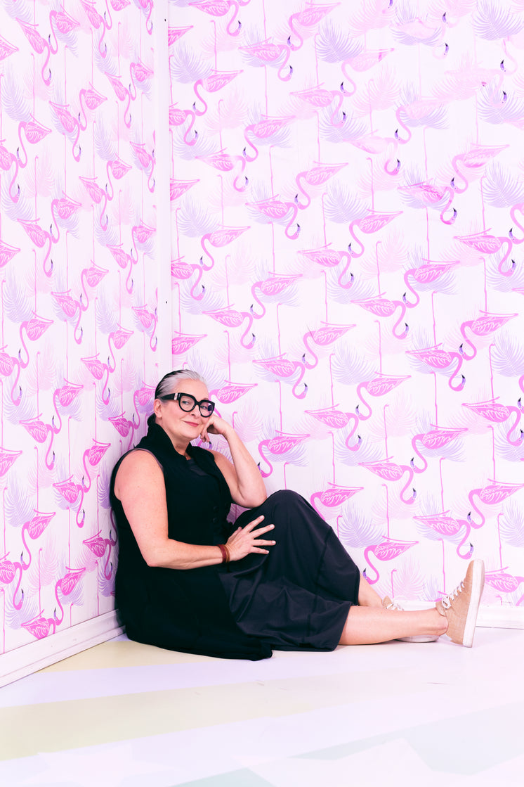 Woman Poses In Pink Room