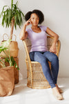 woman posing on wicker seat