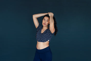 woman posing with hair in hands