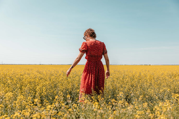 Woman Reaches For Flowers