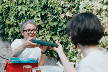 woman received a wrapped gift from a friend