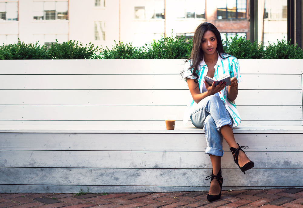 woman relaxing on park bench