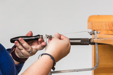 woman replaces fine saw blade