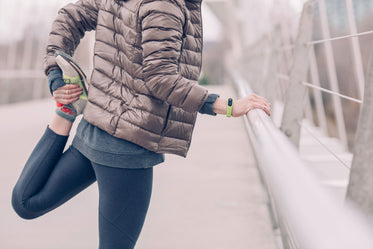 woman stretching before run