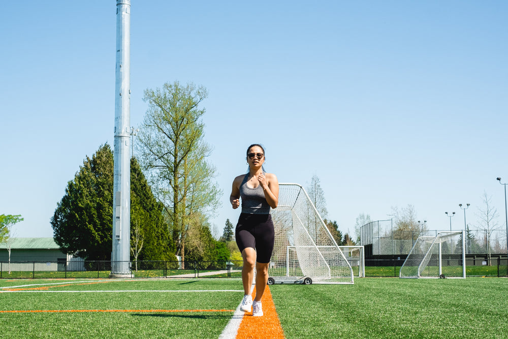 woman runs towards the camera outdoors