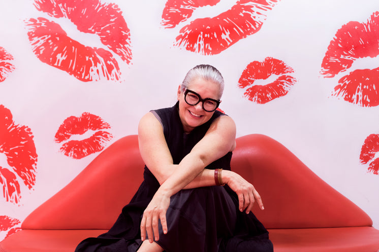 woman-sat-on-red-lip-couch.jpg?width=746