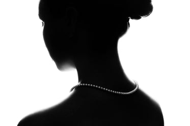 woman silhouette with pearl necklace
