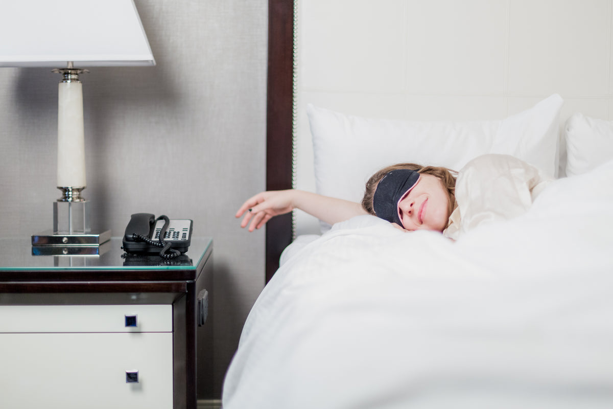 woman sleeping in hotel room