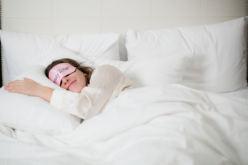 Sleepy woman sleeping in the bed. Stock Photo by ©Voyagerix 113889386
