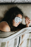 woman sleeps with a eye mask