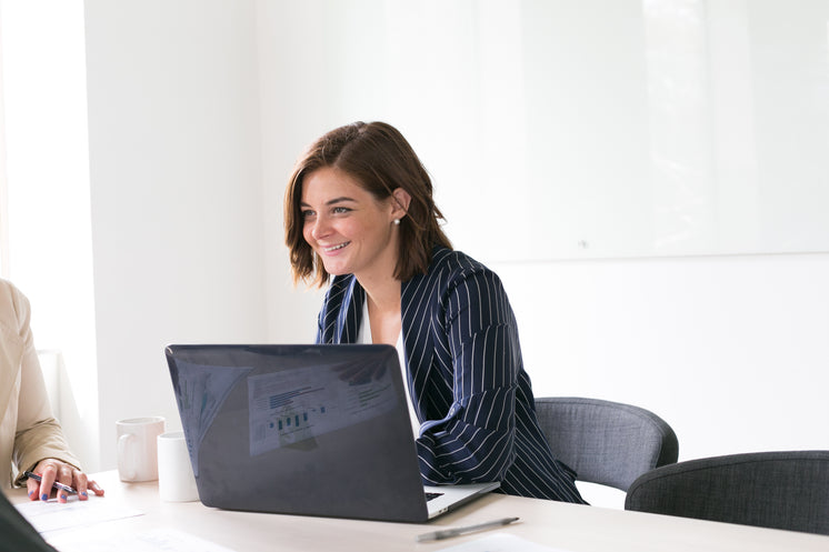 woman-smiling-with-laptop.jpg?width=746&