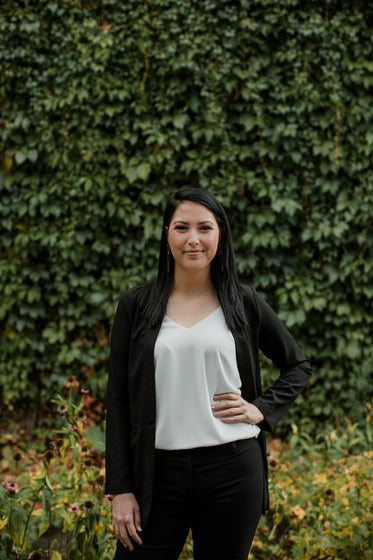 woman stands with her hand on her hips