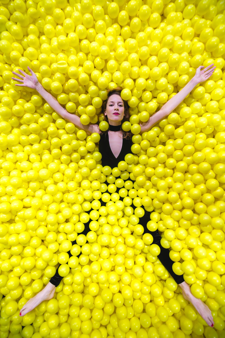 Woman Star Fishes In Ball Pool