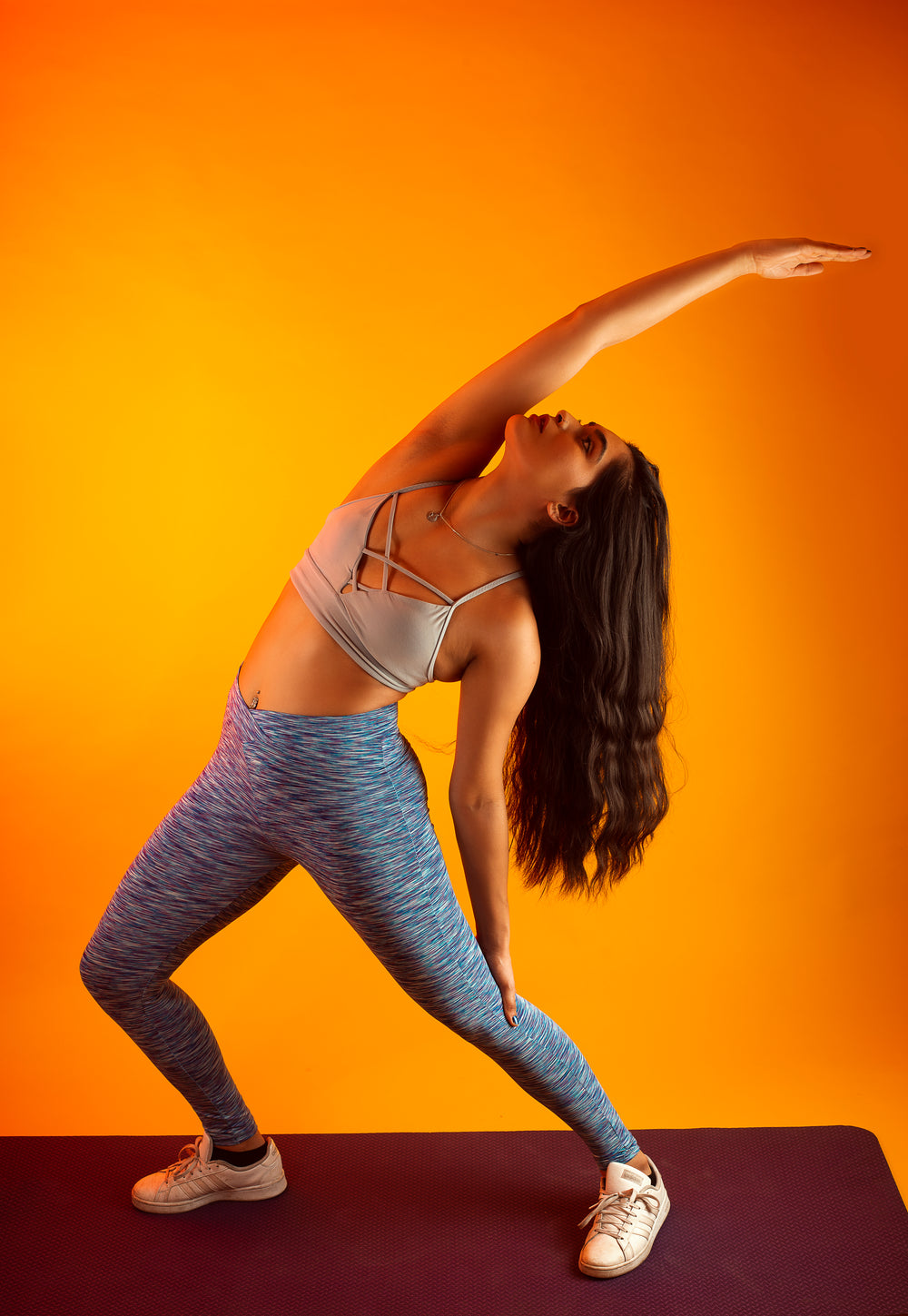 woman stretching on yoga mat