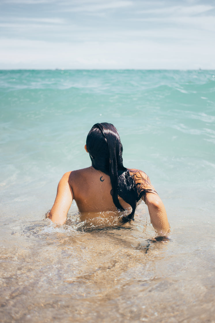 woman-swims-in-ocean.jpg?width=746&forma