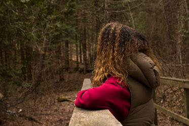 woman takes a moment while on a hike